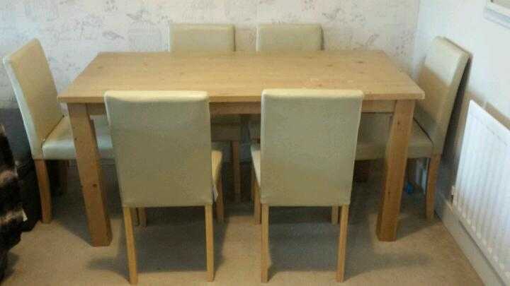 dining table and 6 cream chairs