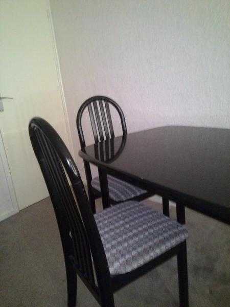 Dining Table and Chairs. Used 6 Place Dining Table in black with 6 Chairs in black