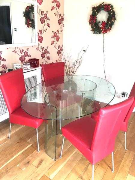Dining table and four red leather chairs