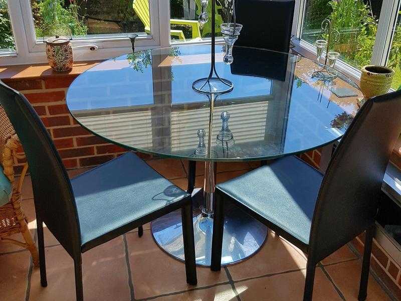 Dining Table. Round glass top with four chairs