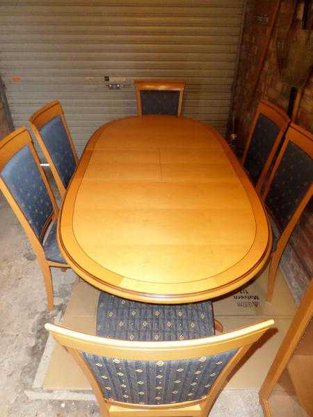 Diningroom table six chairs and display cabinet.