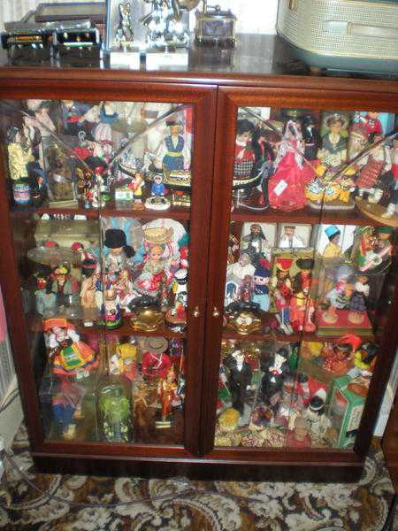 DISPLAY CABINET FULL OF DOLLS