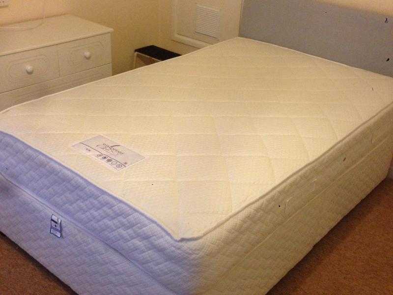 Double bed with near new mattress