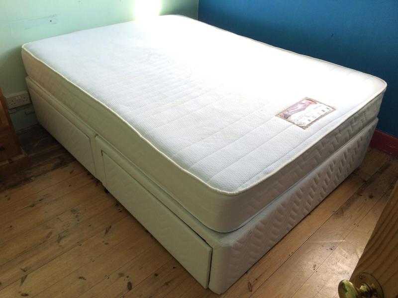 Double bed with nearly new mattress.