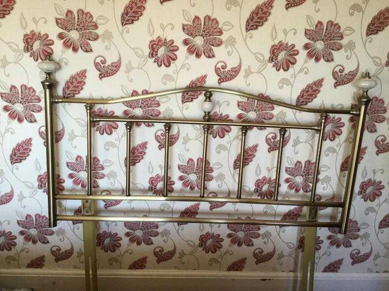 Double brass headboard.