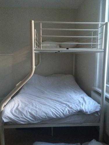 Double bunk bed with single bunk above