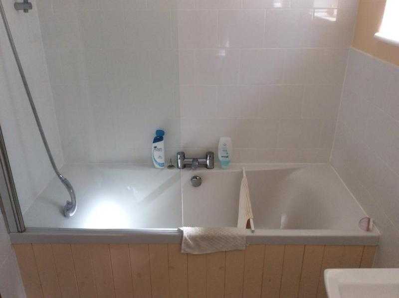 Double ended bath with taps