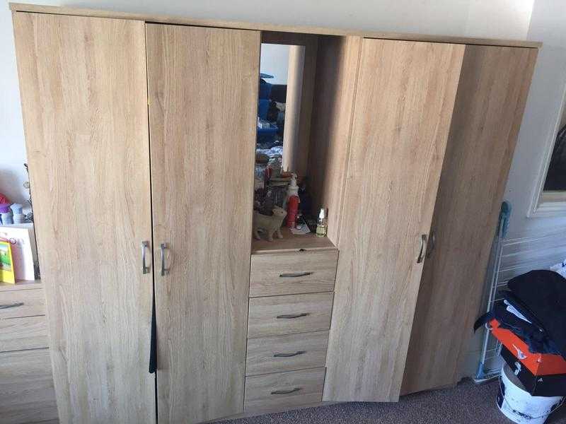 Double wardrobe with built in drawers and mirror