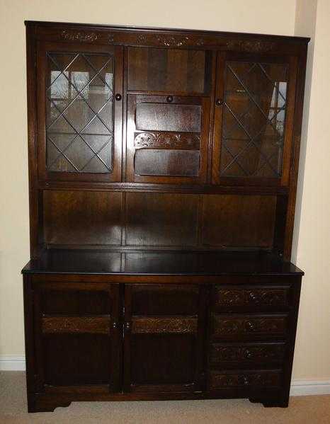 Dresser in dark oak with 2 glazed and one hinged cupboard.