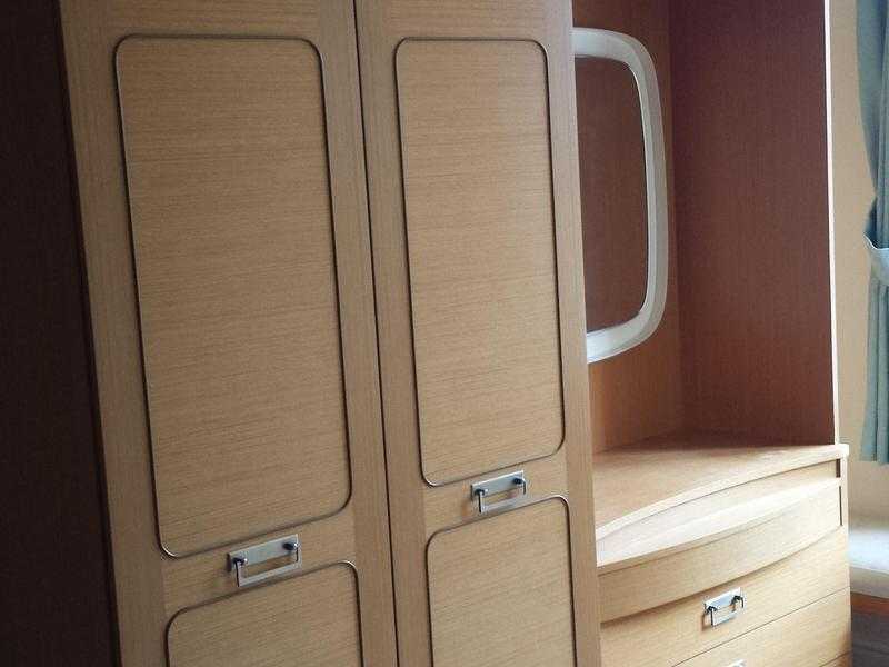 Dressing table with hinged cupboard over and mirror.