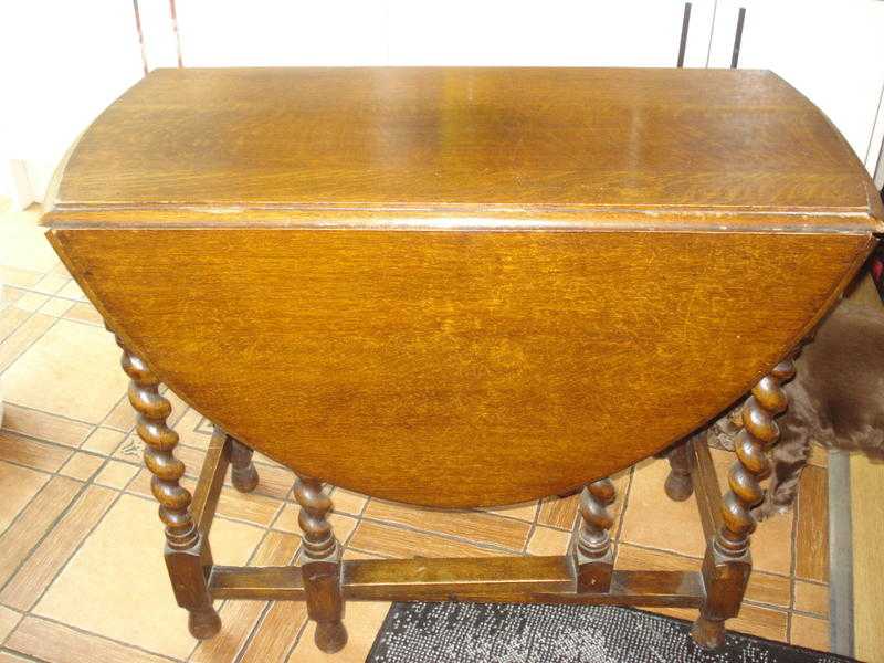 Drop Leaf, gate legged oval solid oak dining table