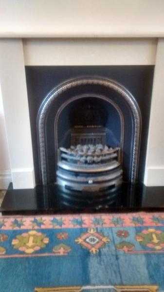 Electric fire with cast iron surround granite hearth marble mantelpiece