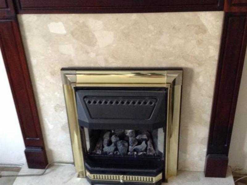 Electric Fire with Marble hearth fire place and Dark Oak Surround