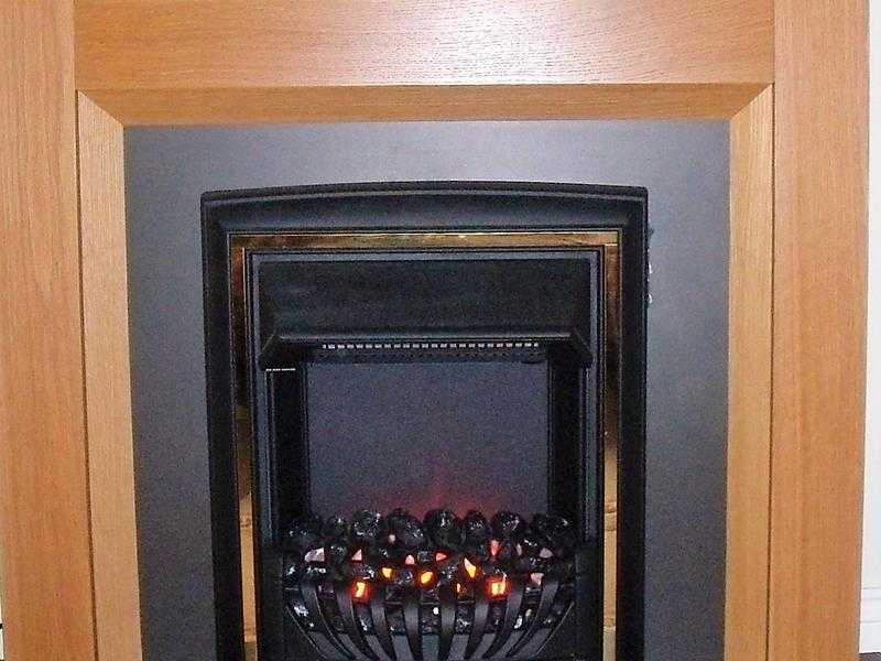 Electric flame effect fire with Oak effect surround