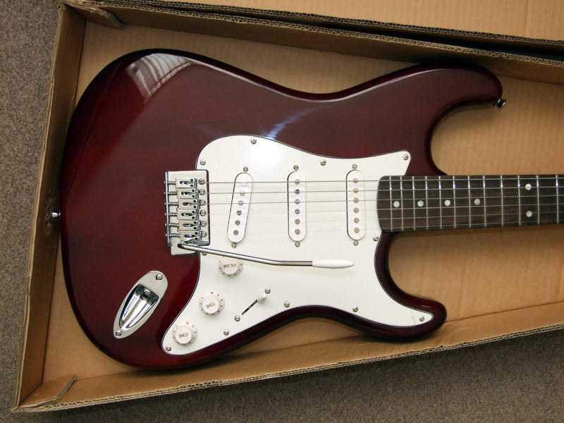 ELECTRIC GUITAR WITH AMPLIFIER ETC. - Unused with all original packing entirely as new.