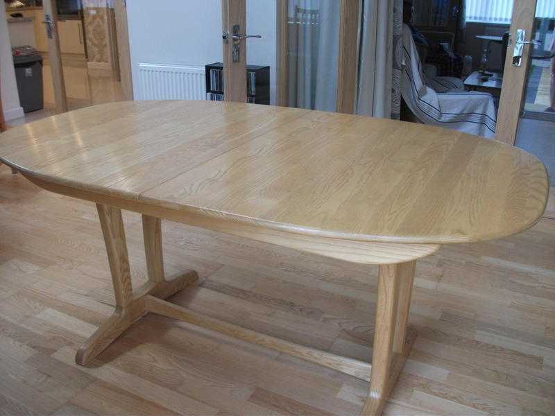 ERCOL MANTUA EXTENDING DINING TABLE. SOLID WOOD LIGHT FINISH