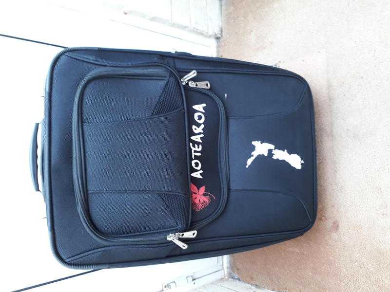 Expandable suitcase with handle and wheels