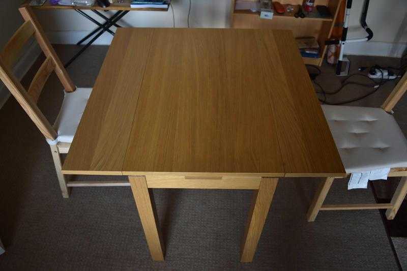 Extendable dinning table and two chairs