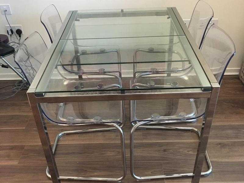 Extendable glass dining table with chairs