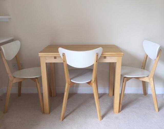 Extendable pine dining table and 3 white amp pine chairs