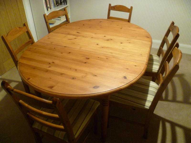 Extendable pine table with six dining chairs