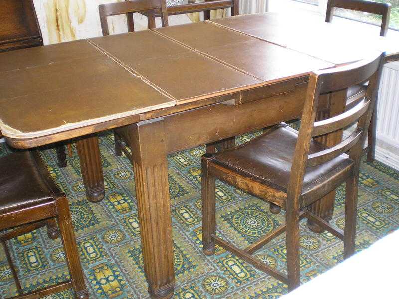 Extendable table and four chair set. Utility style. In a family home for years. Some repairs needed.