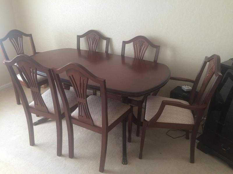 Extending dining room table and 6 chairs