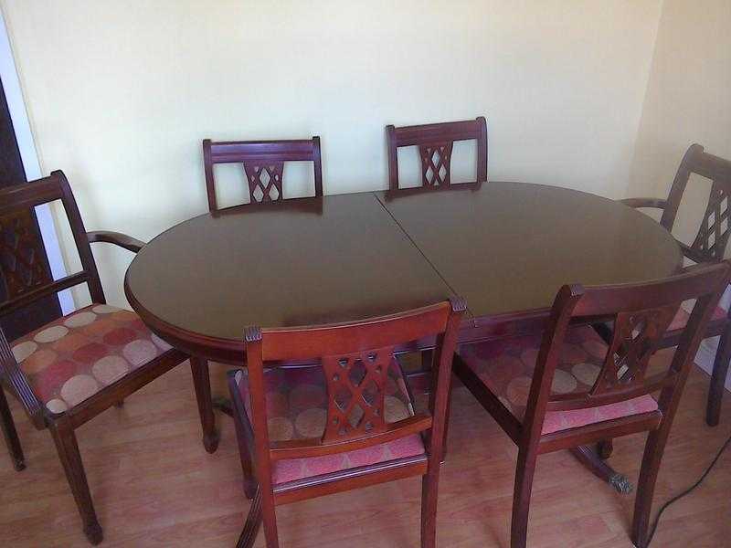 Extending dining table and six chairs
