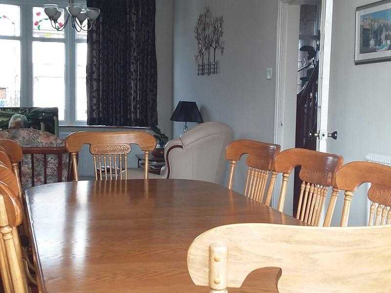 Extending solid oak dining table 8 chairs and free standing unit