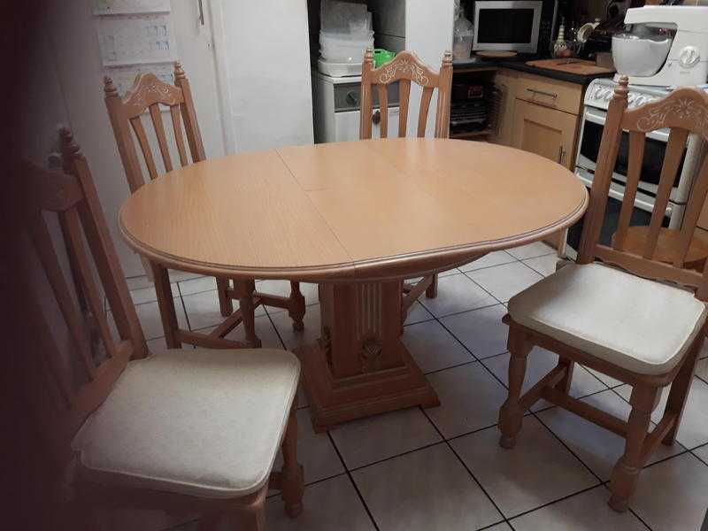 Extending table and  four chairs with cushions