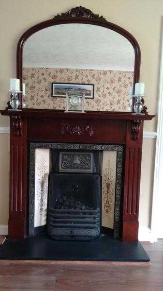 Fire surround with bespoke mirror. Mahogany.