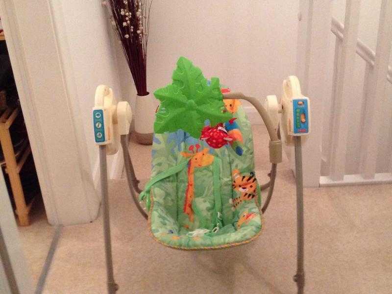 Fisher Price Rainforest baby swing with music.