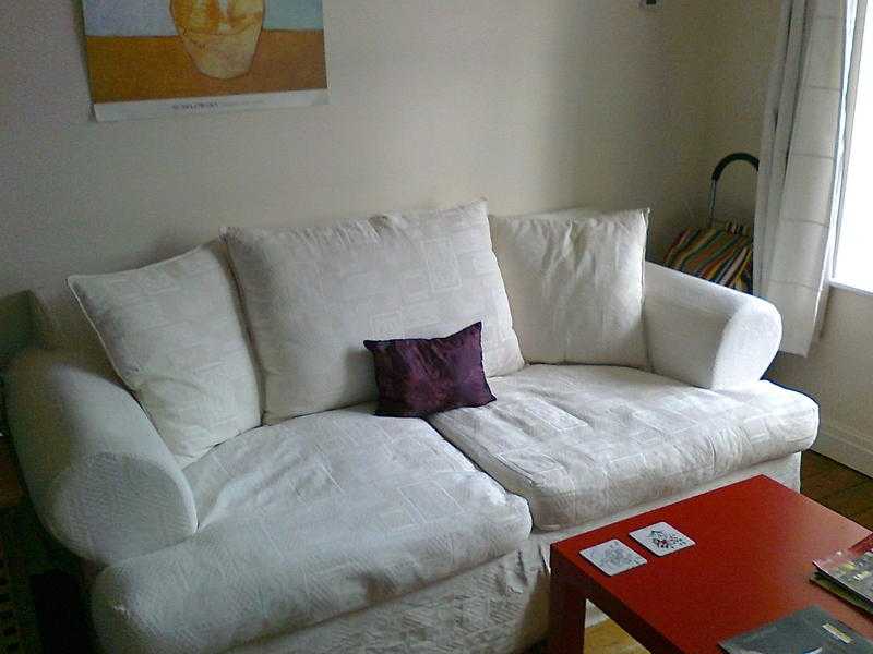 For FREE a white two seater sofa in a good condition