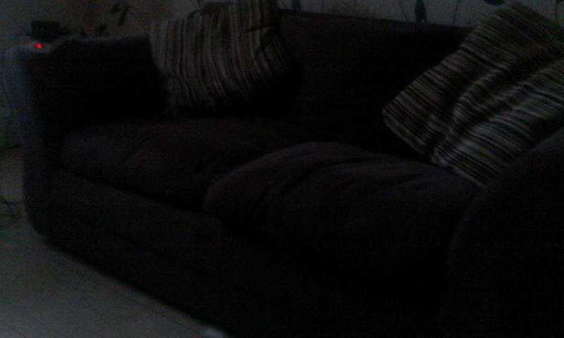 for quick sale dark brown two seater sofa in used but good condition