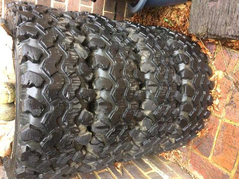 FOUR CHUNKY OFF ROAD TYRES AND RIMS