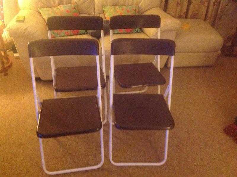 Four Folding Chairs