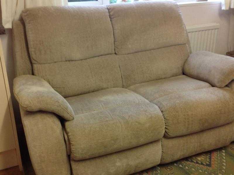 Free to collector. Beige two seater manual recliner in fair condition from non smoking home. i