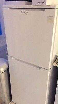 Fridge freezer with shelves draws in white