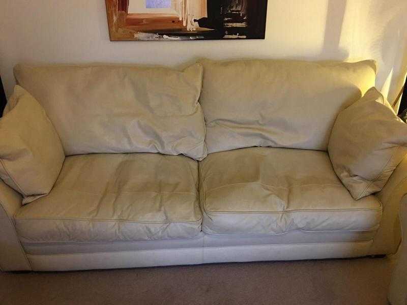 Furniture village high quality cream leather Sofa x2 and foot storage stools x2.500 collection only