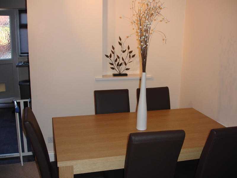 Furniture village oak veneered table and chairs