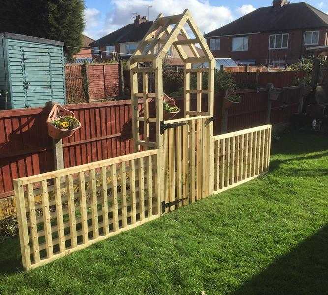 garden arch with side trellis and a gate