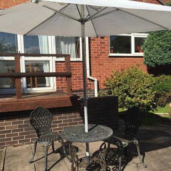Garden table with parasol