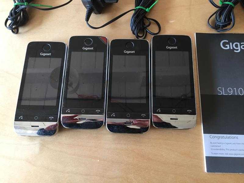 Gigaset SL910SL910A phones 4 handsets, cradles and manuals