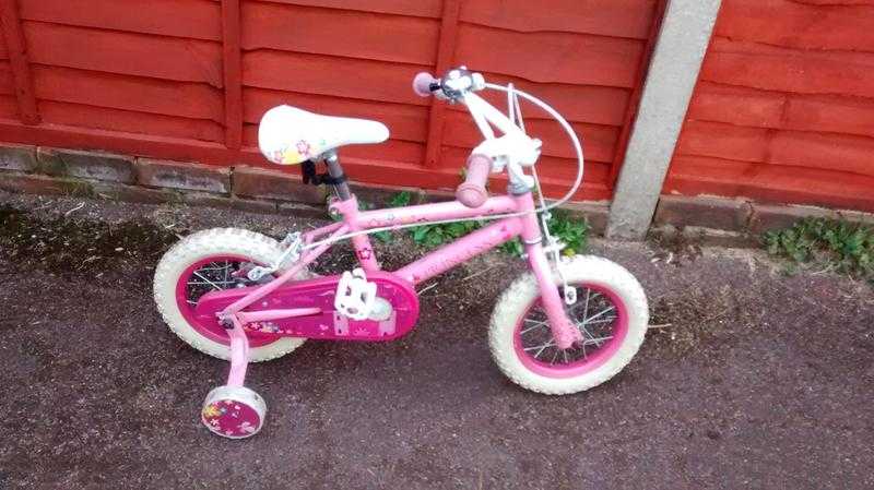 Girl039s pink bike with stabilisers