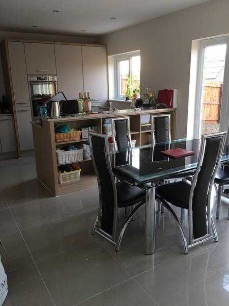 Glass dining room table and chairs