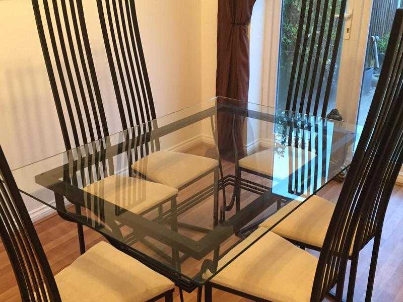 Glass dinning room table and 6 chairs