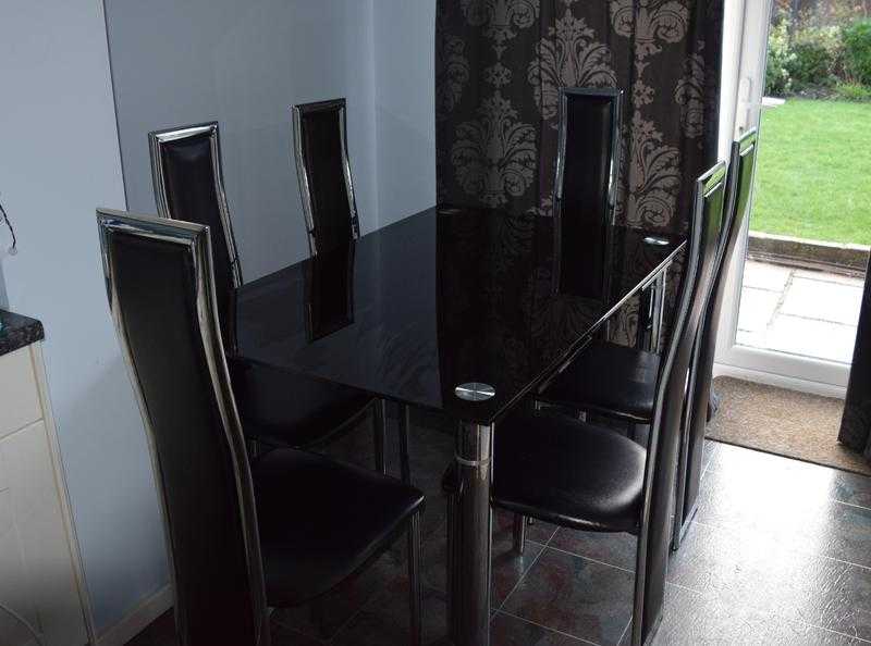 Glass extending dining table and 6 chairs