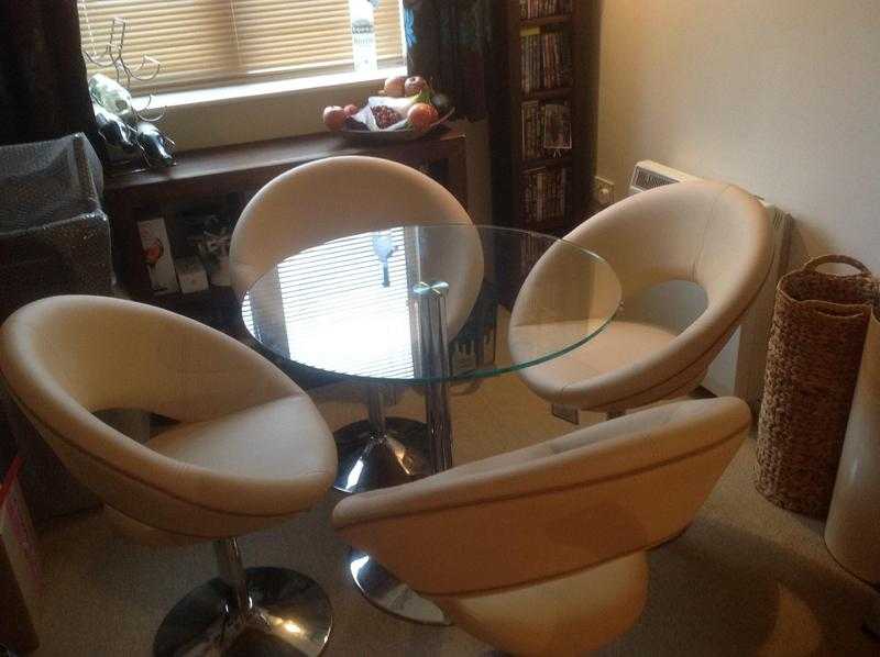 Glass Table and 4 cream leather chairs