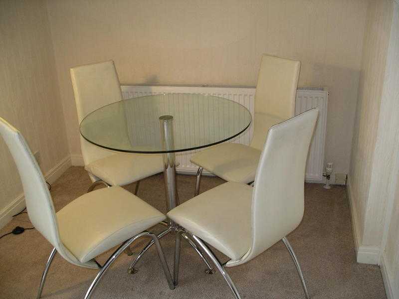 glass table and four chairs