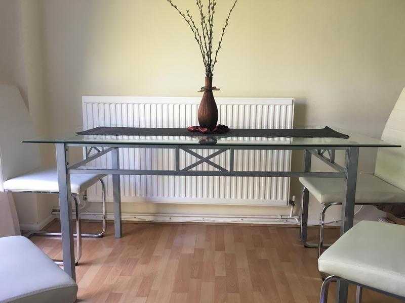 Glass table with 4 chairs